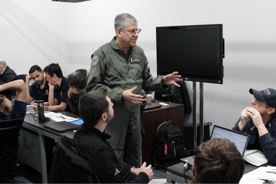 yes (4) Ken Katz standing in middle of room of ITPS team speaking