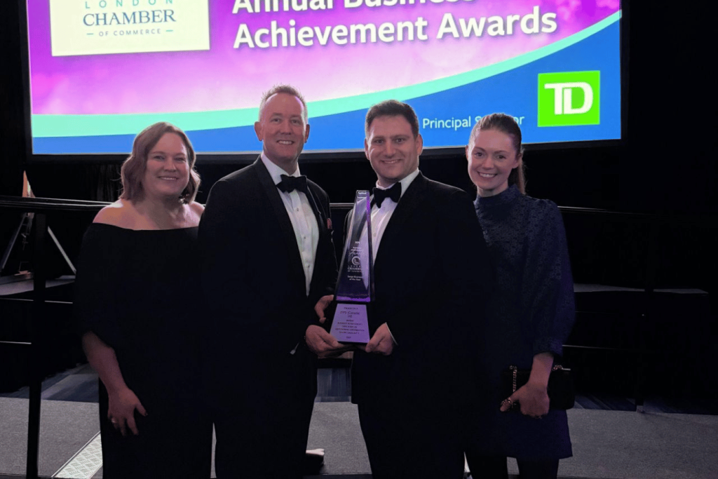 ITPS CEO, and COO, holding trophy