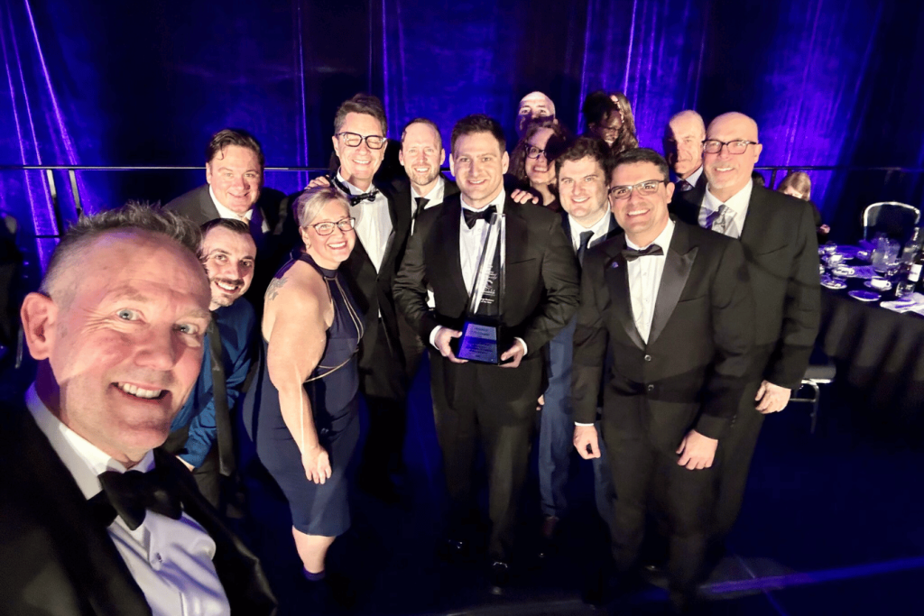 ITPS team at London Chamber of Commerce Business Awards holding trophy