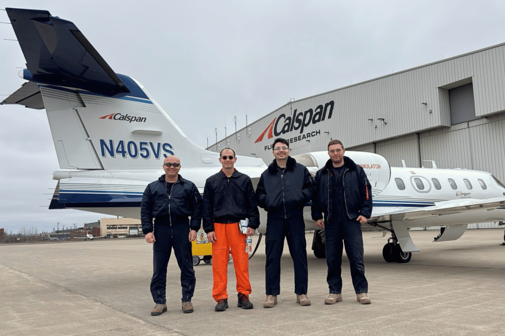 Soner, Alan, Salih, Caner Alan Uehara and ITPS students stand together at Calspan