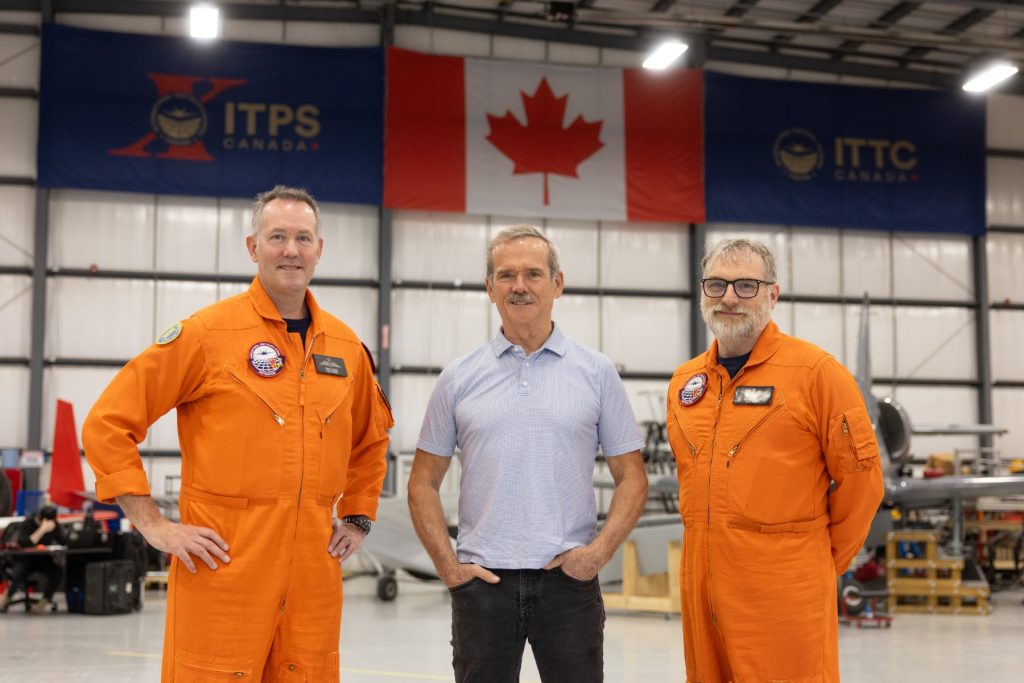 Dave Lohse, CEO, Chris Hadfield, Astronaut, Adam Lowes, RW instructor in ITPS hangar