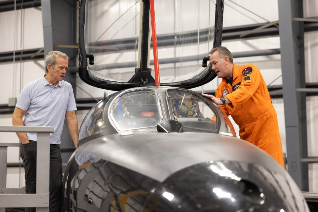 Chris Hadfield and Dave Lohse looking into Hunter cockpit