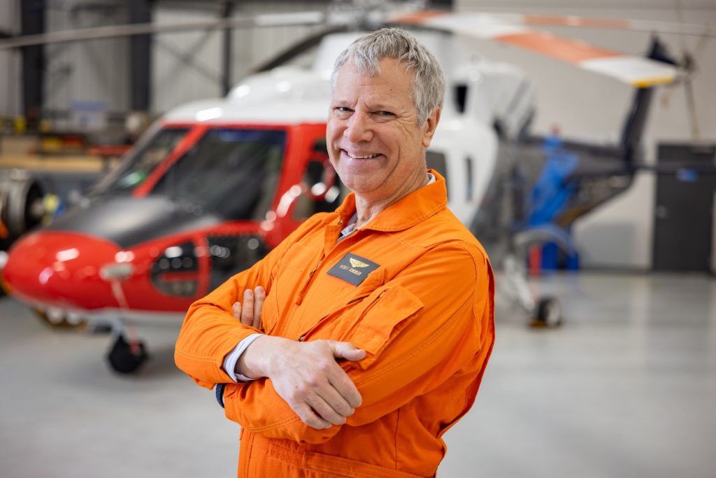 Peter Scheidler in front of ITPS S76 helicopter