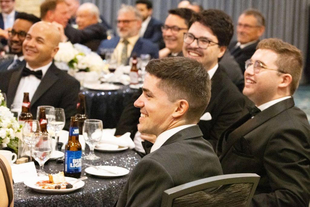 1781829987636 ITPS graduates and instructors at dinner tables for celebration