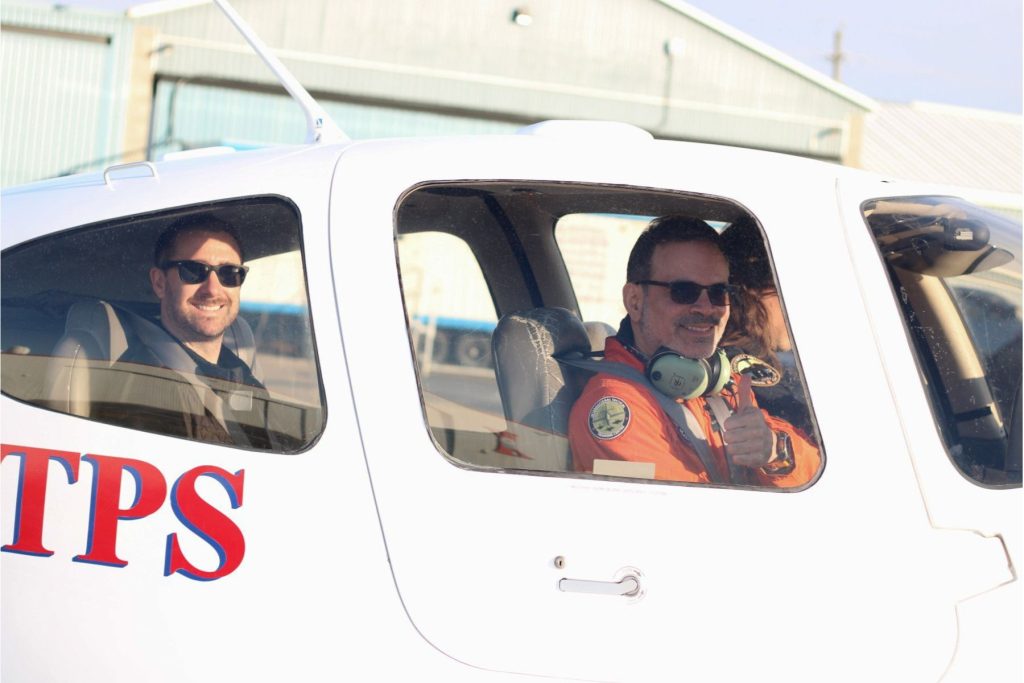 10 Honeywell Aerospace Students in ITPS fixed wing aircraft with ITPS instructor