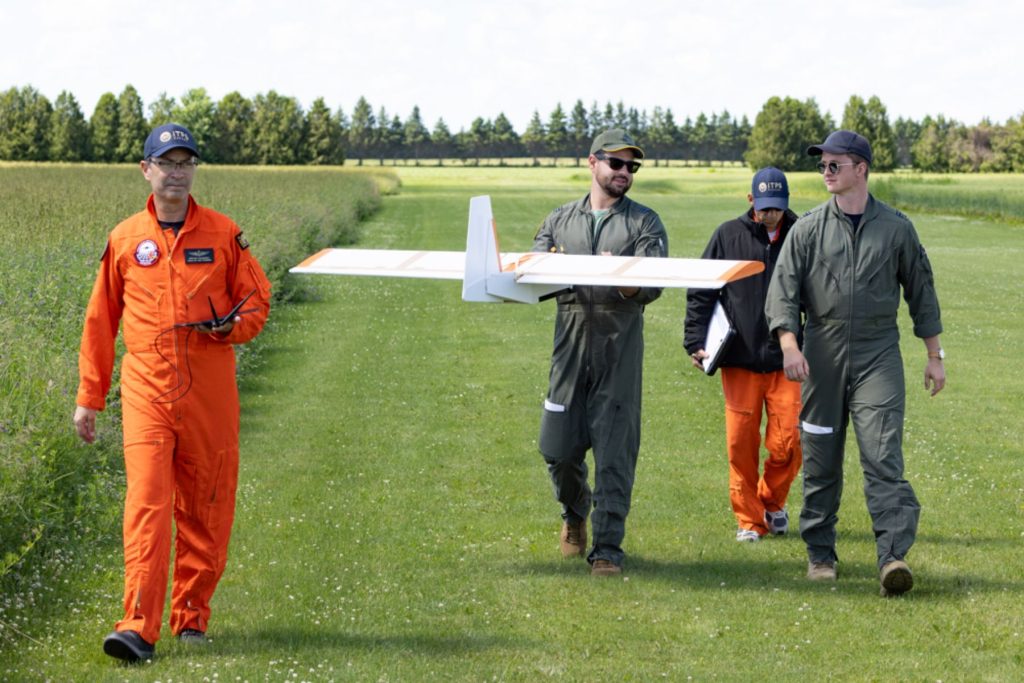 ITPS UAS team and students holding Corvo PPDS drone