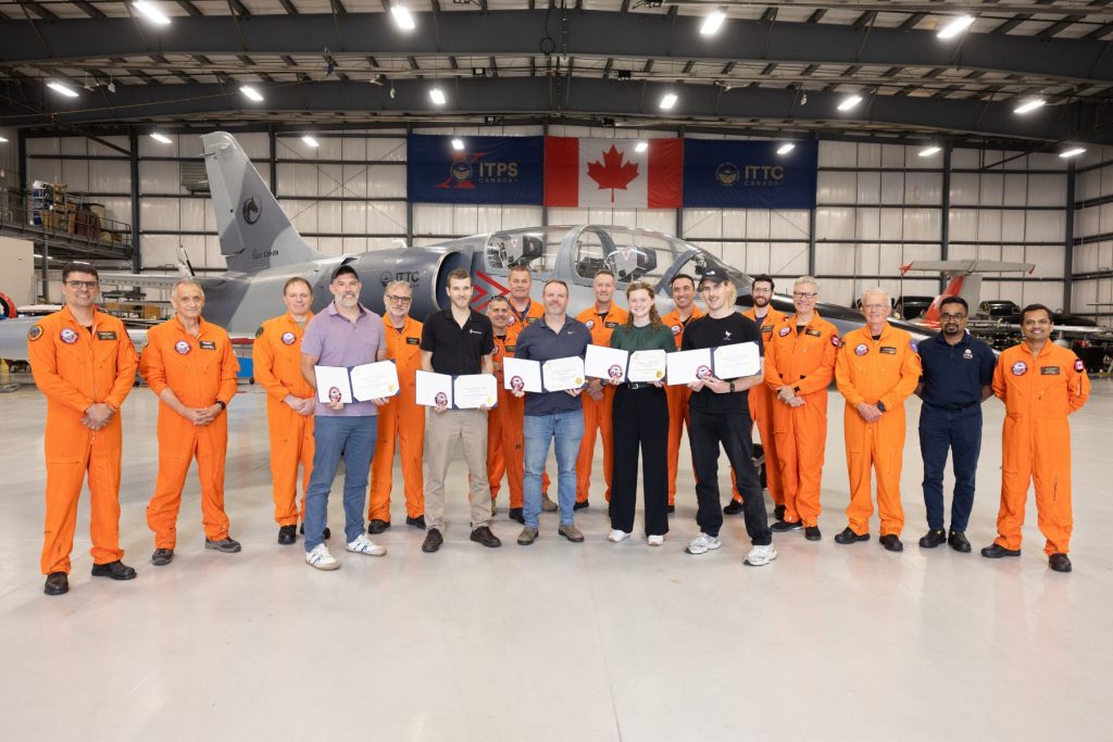 group of ITPS graduating students in ITPS hangar
