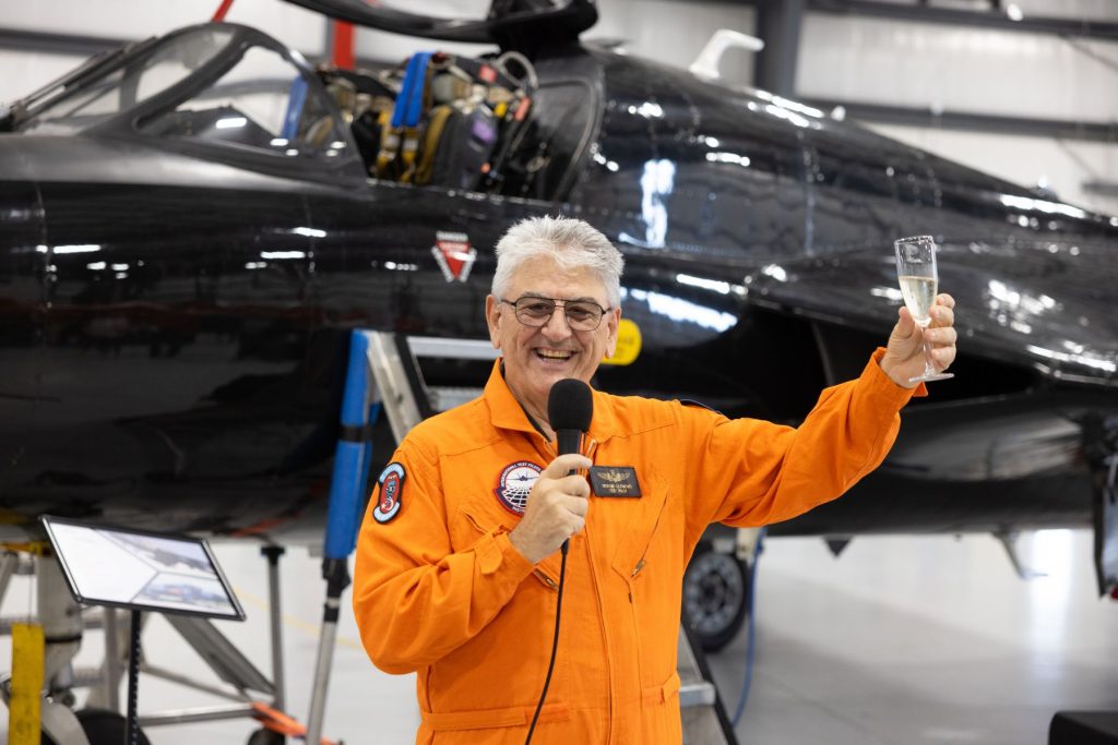 7 Giorgio Clementi raising champagne glass to toast crowd