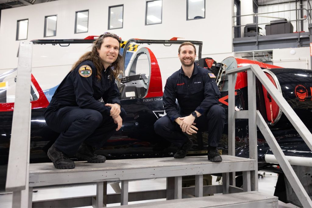 7 Honeywell Aerospace students beside ITPS L39 cockpit