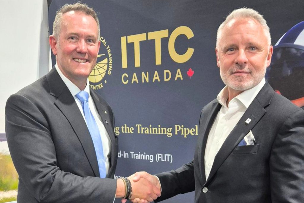 Dave Lohse, CEO, ITPS Canada, shaking hands with man