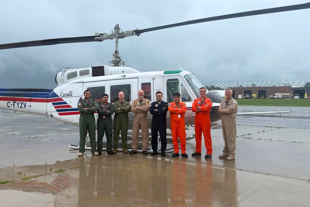 ITPS RW students and NRC in front of VSS helicopter