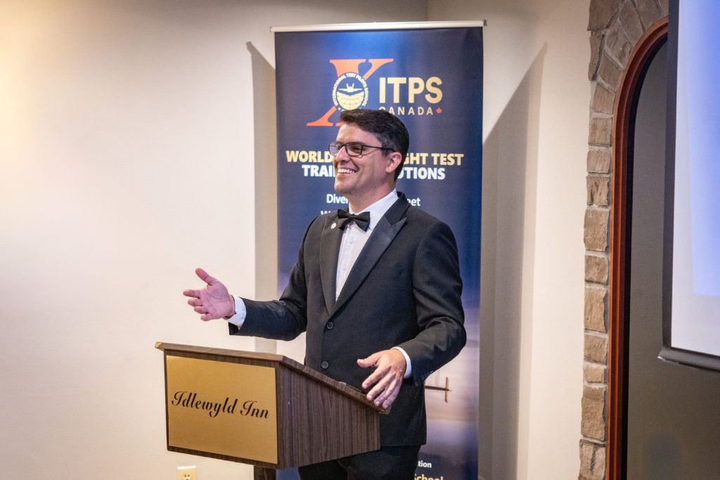 1786564712997 Thiago Macedo, Head of Training, speaking from podium