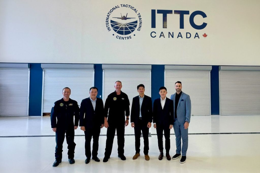 5 ITTC leadership team with RSAF visitors in new ITTC hangar, North Bay