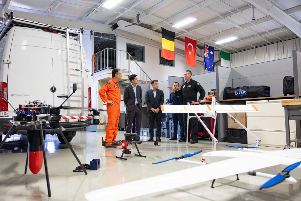 third Dave Lohse and Michael Mulquiney speaking with RSAF visitors in ITPS UAS hangar