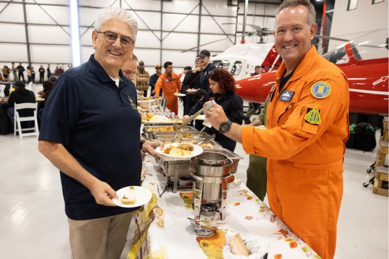 1791746783851 Dave Lohse serving Thanksgiving food to Giorgio Clementi