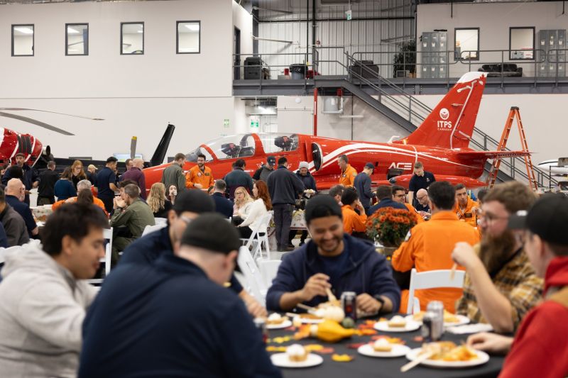 1791746783998 Autumn decorated tables for thanksgiving in aircraft hangar
